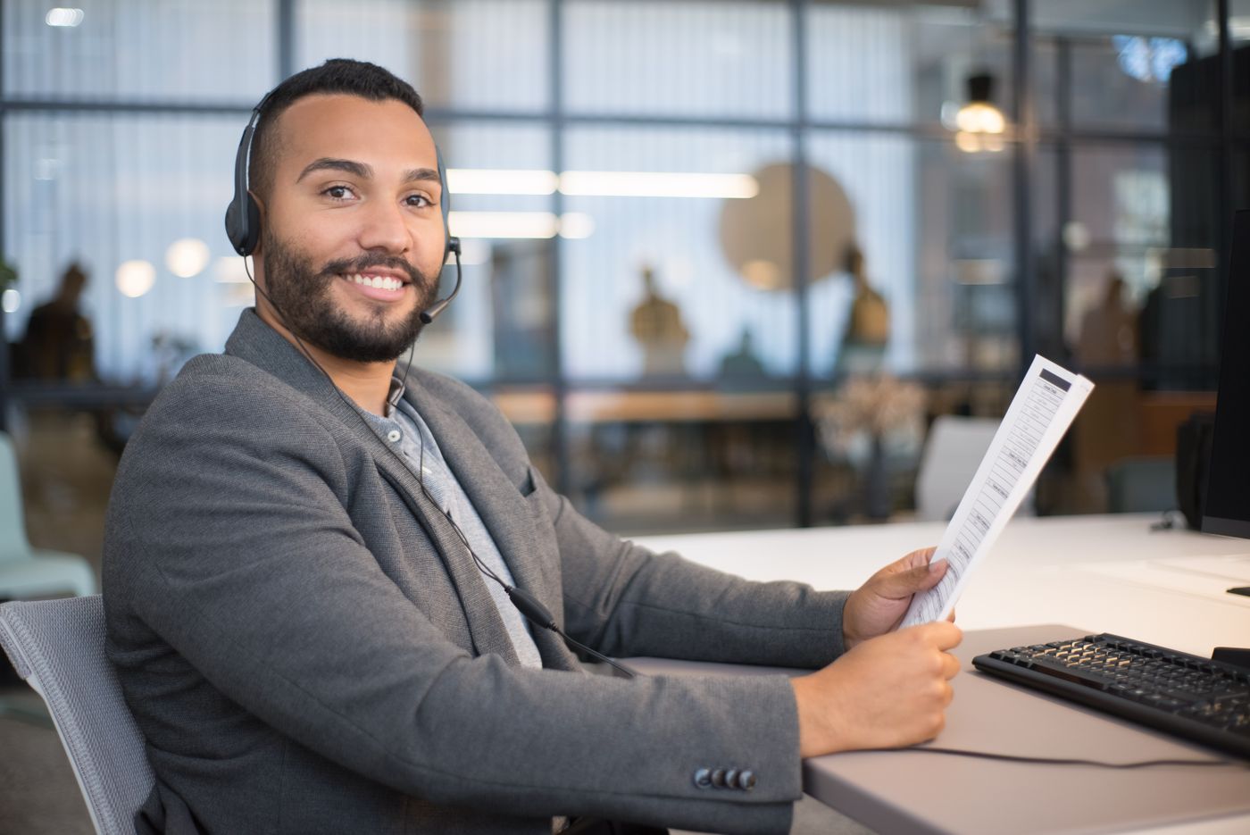 Funding advisor reviewing an application document at his desk