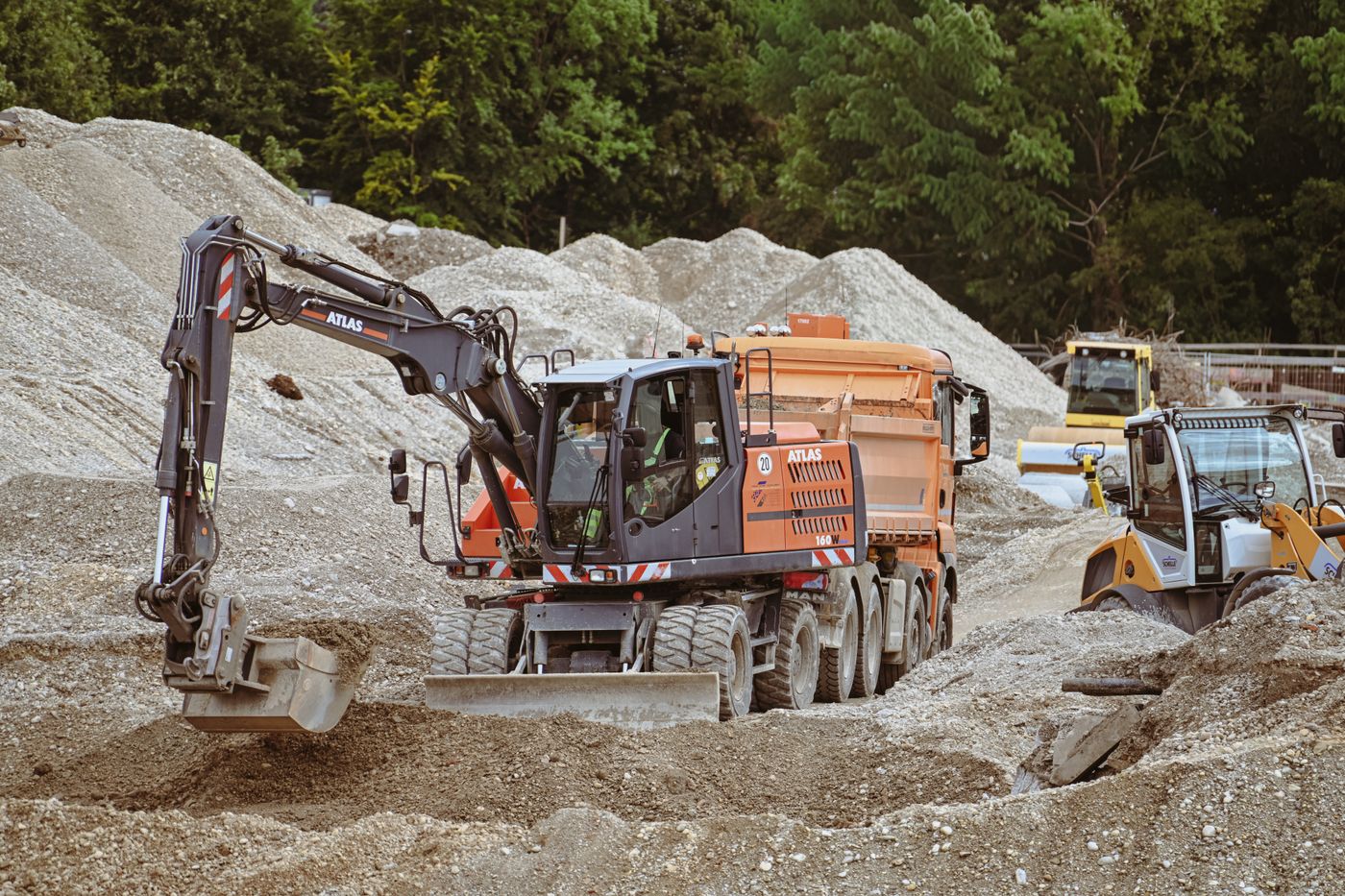 Excavator and heavy machinery working on a construction site